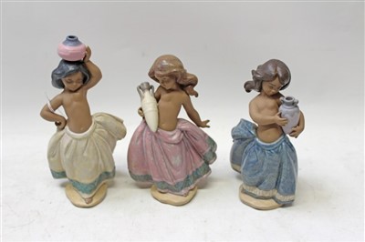 Lot 2017 - Three Lladro porcelain figures – Little Peasant Girl (pink), Little Peasant Girl (blue) and Little Peasant Girl (white), all boxed