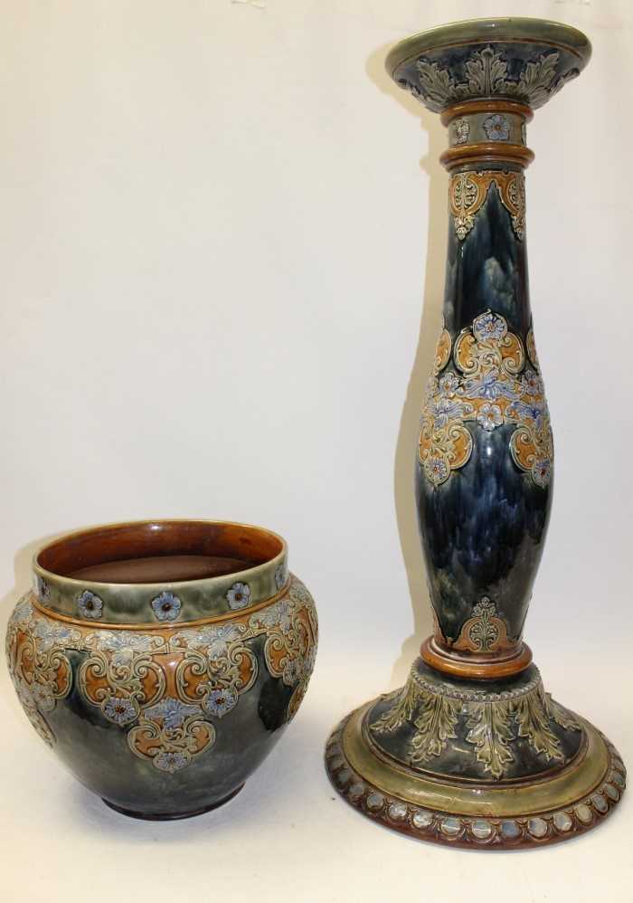 Lot 2020 - Large Royal Doulton stoneware jardinière on stand with applied floral decoration on mottled green and blue ground – impressed marks to base
