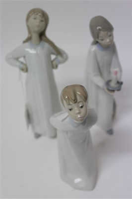 Lot 2066 - Three Lladro porcelain figures – children in nightgowns