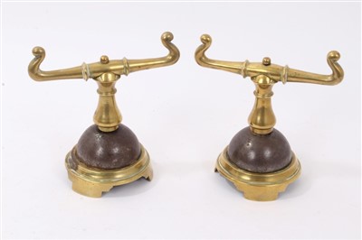 Lot 869 - Pair of Victorian brass fire dogs in the manner of Christopher Dresser
