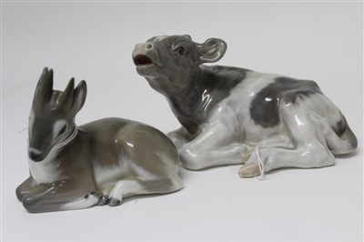 Lot 2068 - Two Royal Copenhagen porcelain models – calf lying down no. 1072 and deer fawn no. 2648
