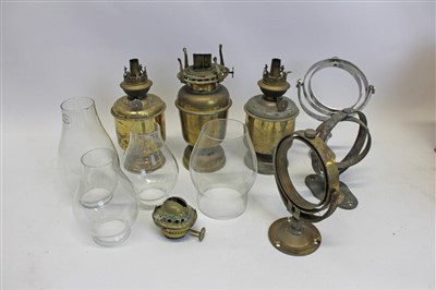 Lot 3511 - Three ships’ oil gimbal lamps, gimblets and glass chimneys (qty)