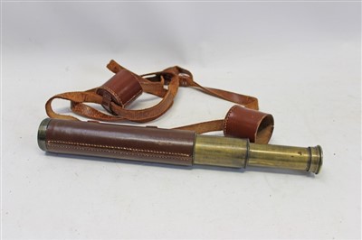 Lot 3556 - Early 20th century brass two-draw spotting telescope with leather hand cover and end caps, signed – Nelson 20x B.C. & Co. Ltd. E.C.1