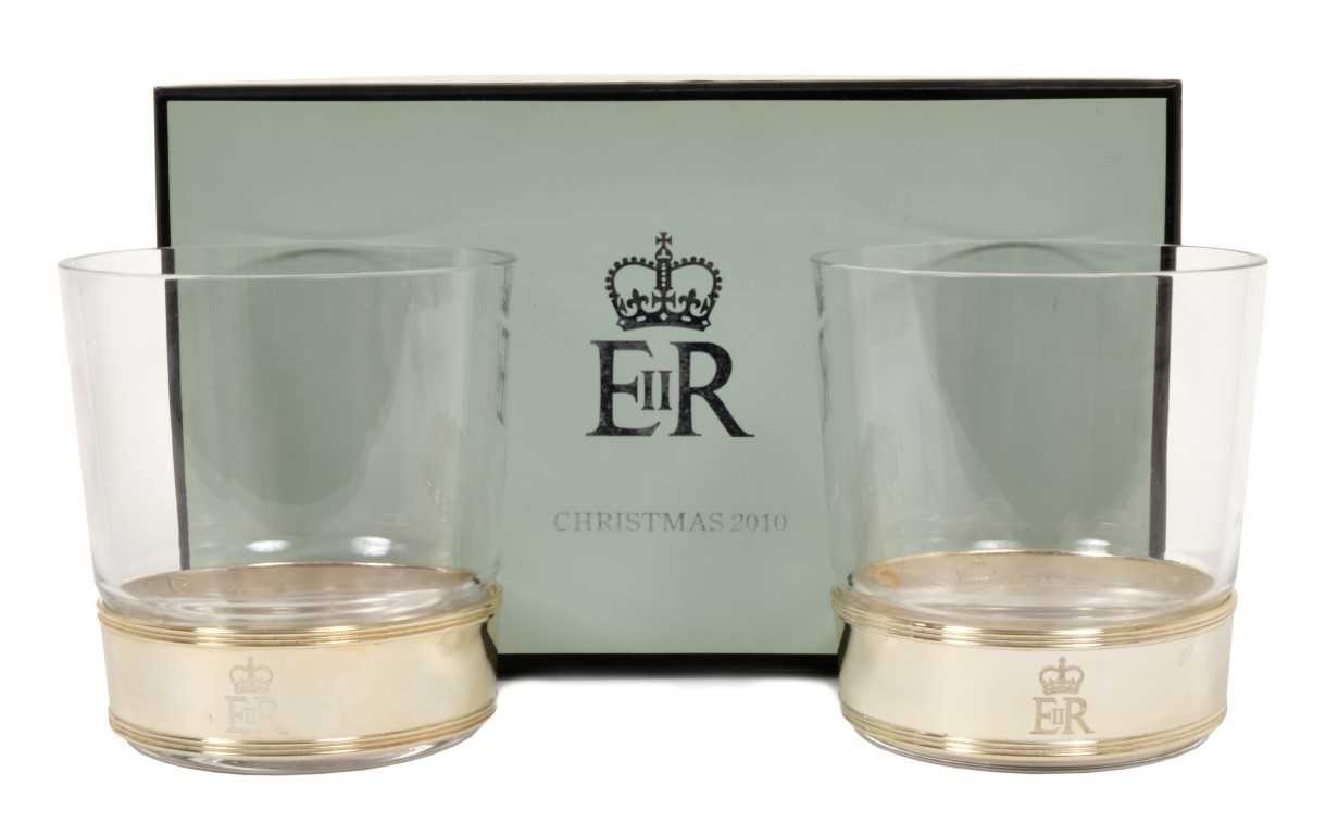 Lot 73 - HM Queen Elizabeth II – Royal Christmas gift 2010 – pair glass tumblers with silver plated collars