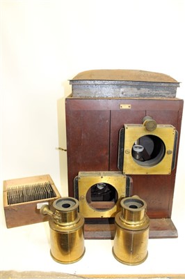 Lot 3574 - Victorian 'Dancer Double Lantern' Magic Lantern with a mahogany outer case and two lenses, by J. B. Dancer