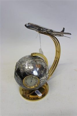 Lot 3583 - 1960s Swiss Angelus novelty desk combined clock barometer and hygrometer set in a revolving silvered terrestrial globe with gilt metal stand supporting a model of a silvered airliner