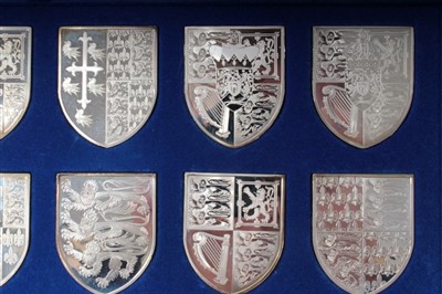 Lot 89 - Set of twelve silver shield-shape plaques depicting the Royal Arms from 1195 until 1977, commemorating the Silver Jubilee