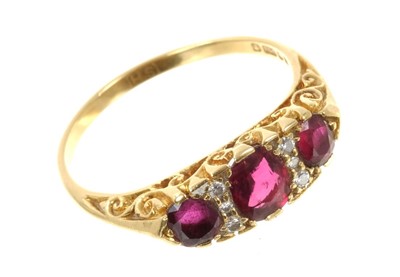 Lot 641 - Victorian-style ruby and diamond ring with three oval mixed cut rubies interspaced by six small brilliant cut diamonds