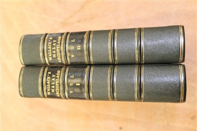 Lot 2437 - Books - Alfred Russel Wallace – The Malay Archipelago – The Land of The Orangutan and The Bird of Paradise, two volumes, tooled leather binding, 1869, first edition