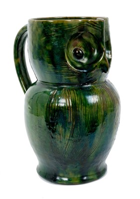 Lot 261 - Late 19th century Farnham pattern pottery owl jug with green and brown glaze and incised decoration