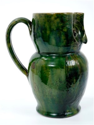 Lot 261 - Late 19th century Farnham pattern pottery owl jug with green and brown glaze and incised decoration