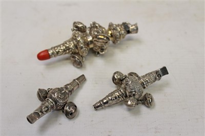 Lot 3588 - Early Victorian silver child’s rattle with embossed decoration with ten bells (four remaining), whistle and coral teething bar (Birmingham 1834), George Unite, together with two other smaller late...