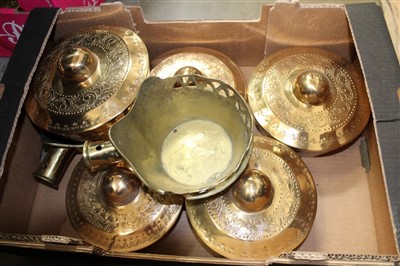 Lot 3598 - Two boxes containing ten Eastern brass gongs with engraved decoration and two other brass scoops (12)