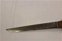 Lot 847 - Japanese Tanto dagger with ribbed wooden hilt, in black lacquer scabbard with white metal mounts, 26.5cm in overall length.