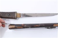 Lot 847 - Japanese Tanto dagger with ribbed wooden hilt, in black lacquer scabbard with white metal mounts, 26.5cm in overall length.