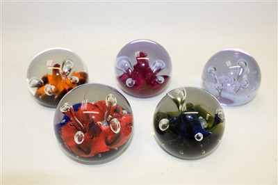 Lot 2134 - Five Caithness glass Moonflower paperweights, circa 1970, by Colin Terris