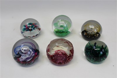 Lot 2143 - Six Selkirk Glass paperweights by Peter Holmes – green seaweed facet cut 1980, pink crystal 1985, almond mosaic 1986, gold swirl with gold fleck base 2004, green embrace 1988 and samba (magnum size...
