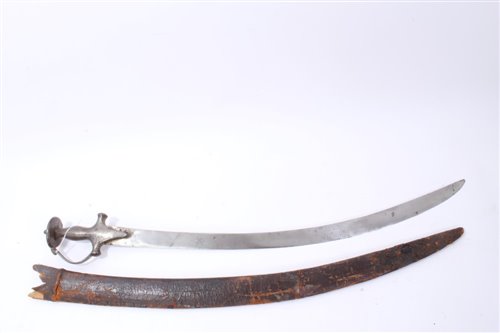 Lot 851 - 19th Century Indian Tulwar with disc pommel, scroll guard and curved blade in leather scabbard