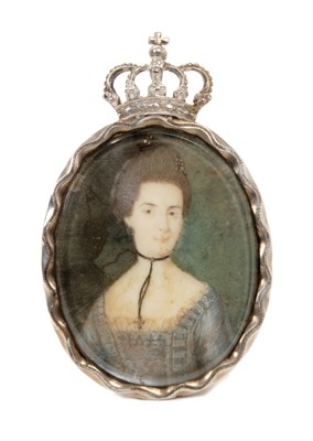 Lot 103 - 18th century miniature on ivory portrait of a noblewoman wearing a black ribbon and crucifix, pale-grey dress with lace trimming in silver frame brooch mount