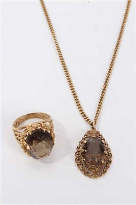 Lot 3280 - Gold (9ct) smokey quartz cocktail ring and similar pendant necklace