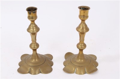 Lot 812 - Pair of Queen Anne brass candlesticks