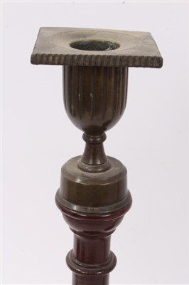 Lot 819 - Pair of George III mahogany and brass mounted candlesticks