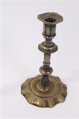Lot 822 - Four early 18th century brass candlesticks