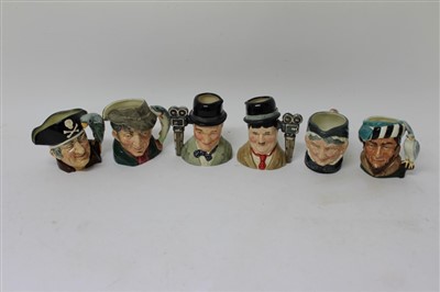Lot 2170 - Six Royal Doulton medium character jugs – Stan Laurel, Oliver Hardy, Granny, The Poacher, Long John Silver and The Falconer