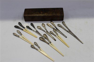 Lot 3679 - Nine Victorian and later silver mounted glove stretchers in Victorian glove box (10)