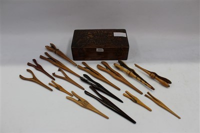 Lot 3681 - Collection of fourteen Victorian treen glove stretchers – including Mauchline ware and fox-head terminals, in wooden box