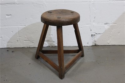 Lot 1413 - Antique Welsh oak, pine and elm rustic stool with circular seat on three legs joined by stretchers