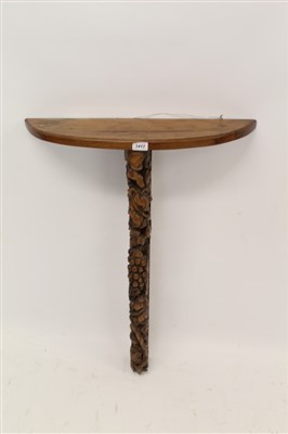 Lot 1417 - 19th century carved yew wood bracket with bowed shelf