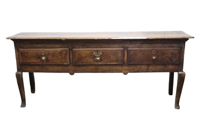 Lot 1423 - Mid-18th century oak and fruitwood crossbanded low dresser with three short drawers, on squared cabriole legs, 188cm wide x 41cm deep x 79cm high