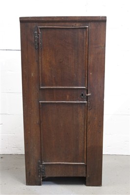 Lot 1441 - 18th century oak standing corner cupboard, interior of shelves enclosed by panelled door, on stiles, 65cm wide x 34cm deep x 140cm high