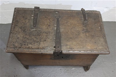 Lot 1448 - Early 17th century oak six-plank coffer of small proportions, with strap iron work and carved edging, 64cm wide