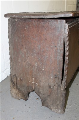 Lot 1448 - Early 17th century oak six-plank coffer of small proportions, with strap iron work and carved edging, 64cm wide
