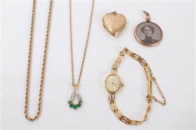 Lot 3306 - Gold emerald and diamond pendant on chain, gold rope twist chain, gold ladies wristwatch and two locket pendants