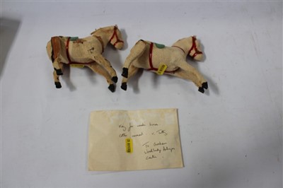 Lot 2899 - Two cloth covered wooden clockwork horses, with key