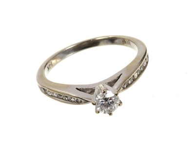 Lot 696 - Diamond single stone ring with diamond set shoulders with valuation certificate