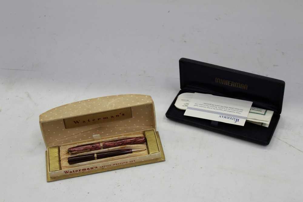 Lot 3705 - Late 1940s / early 1950s Waterman 512V ladies’ mottled purple pen and pencil set, with directions and original guarantee in original case, together with an empty Waterman’s case (2)