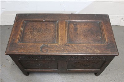 Lot 1457 - Good 17th century carved and panelled oak coffer with panelled top, carved arcaded frieze with initials T.S. and two lozenge carved panels, castellated apron with stile legs and turned feet, 95cm w...