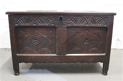 Lot 1457 - Good 17th century carved and panelled oak coffer with panelled top, carved arcaded frieze with initials T.S. and two lozenge carved panels, castellated apron with stile legs and turned feet, 95cm w...