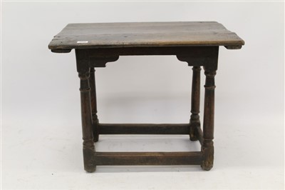 Lot 1458 - 17th century carved oak side table with plank top above a lunette carved frieze on gun barrel turned supports joined by stretchers, 69cm wide