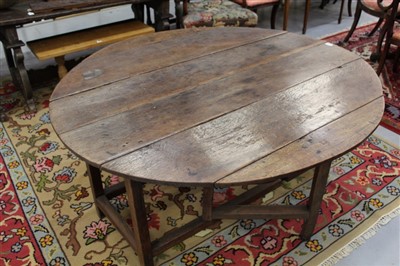 Lot 1459 - Early 18th century oak and elm oval gateleg dining table with plank top, on square chamfered legs joined by stretchers, opening to 138cm x 146cm