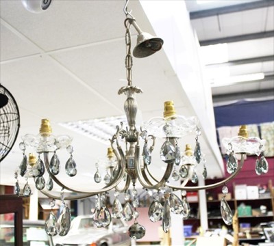 Lot 182 - A large cast metal and glass twelve-light chandelier, together with one other smaller with six lights (2)