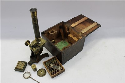 Lot 3737 - 19th century brass microscope by Newton Temple Bar, London, with slides, in a fitted case with original trade label