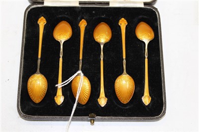 Lot 3772 - Set of six early 20th century silver and orange guilloche enamel coffee spoons