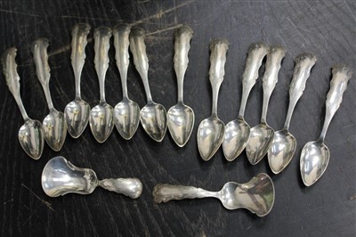 Lot 3773 - Set of twelve 19th century Dutch silver teaspoons with engraved handles, together with two matching caddy spoons