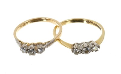 Lot 627 - Two diamond three stone rings