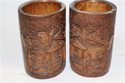 Lot 194 - Pair of late 19th century Chinese carved bamboo brush pots with figural decoration, 18.5cm high